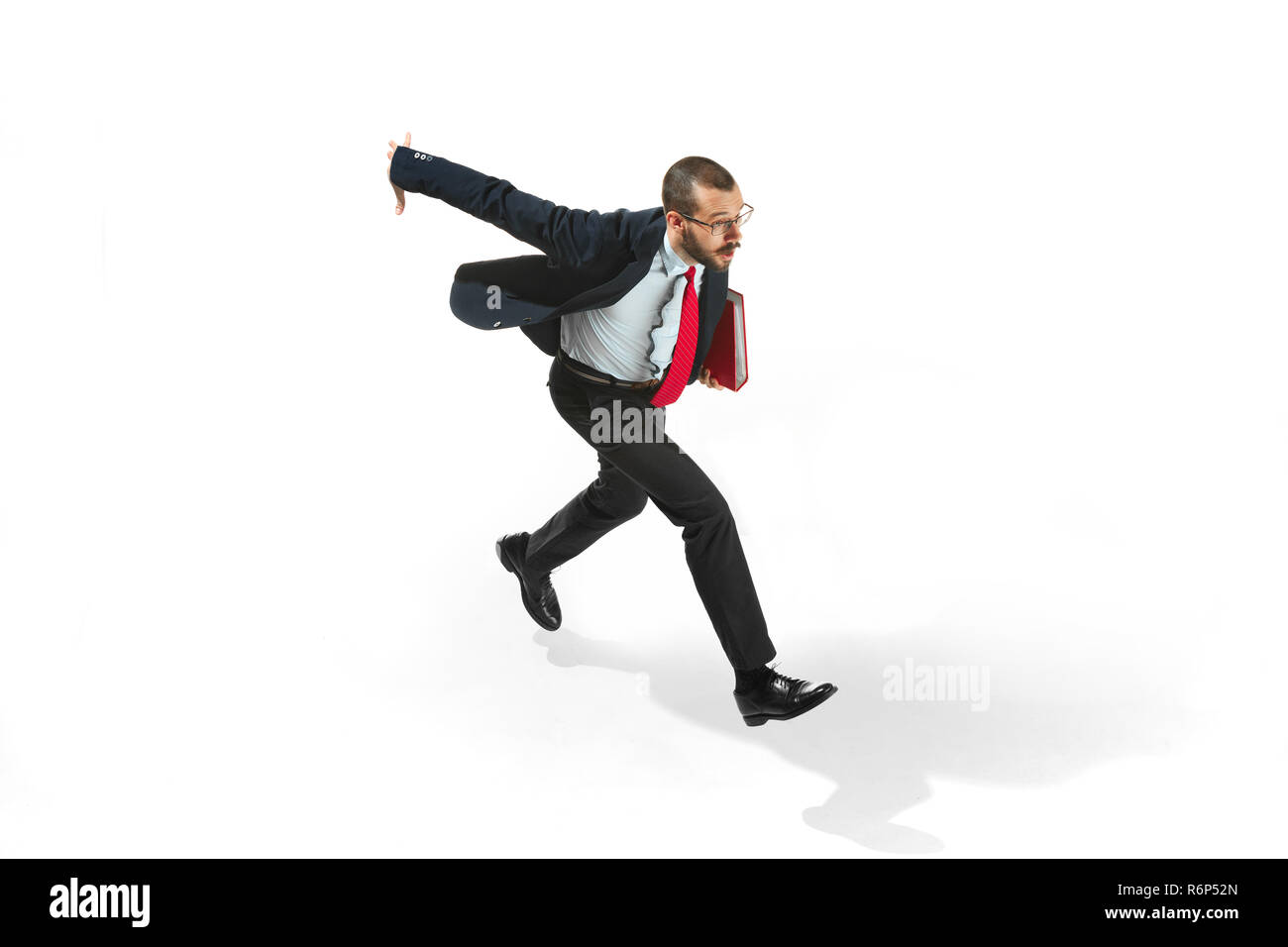 Businessman running with a folder on white background Stock Photo