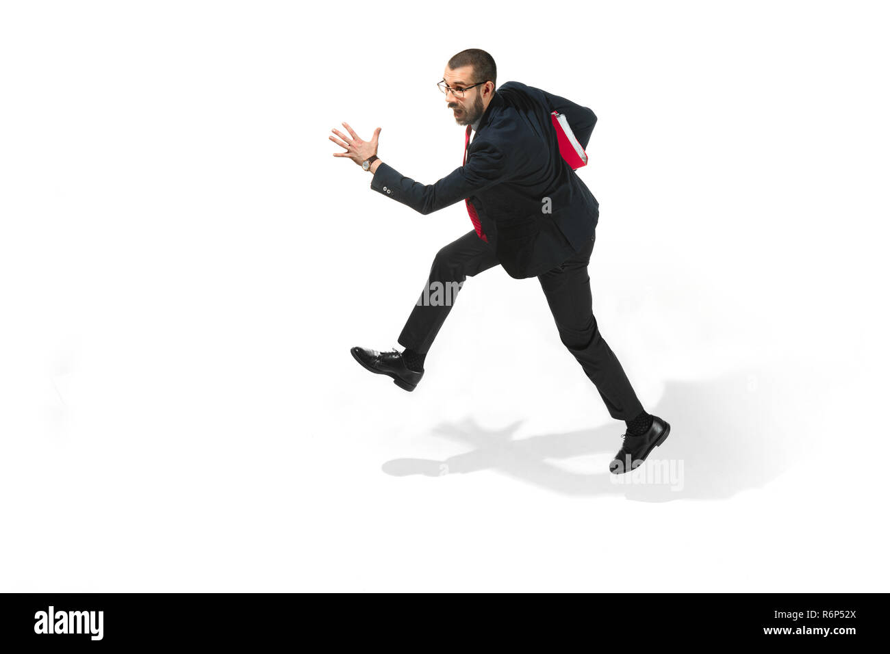 Businessman running with a folder on white background Stock Photo