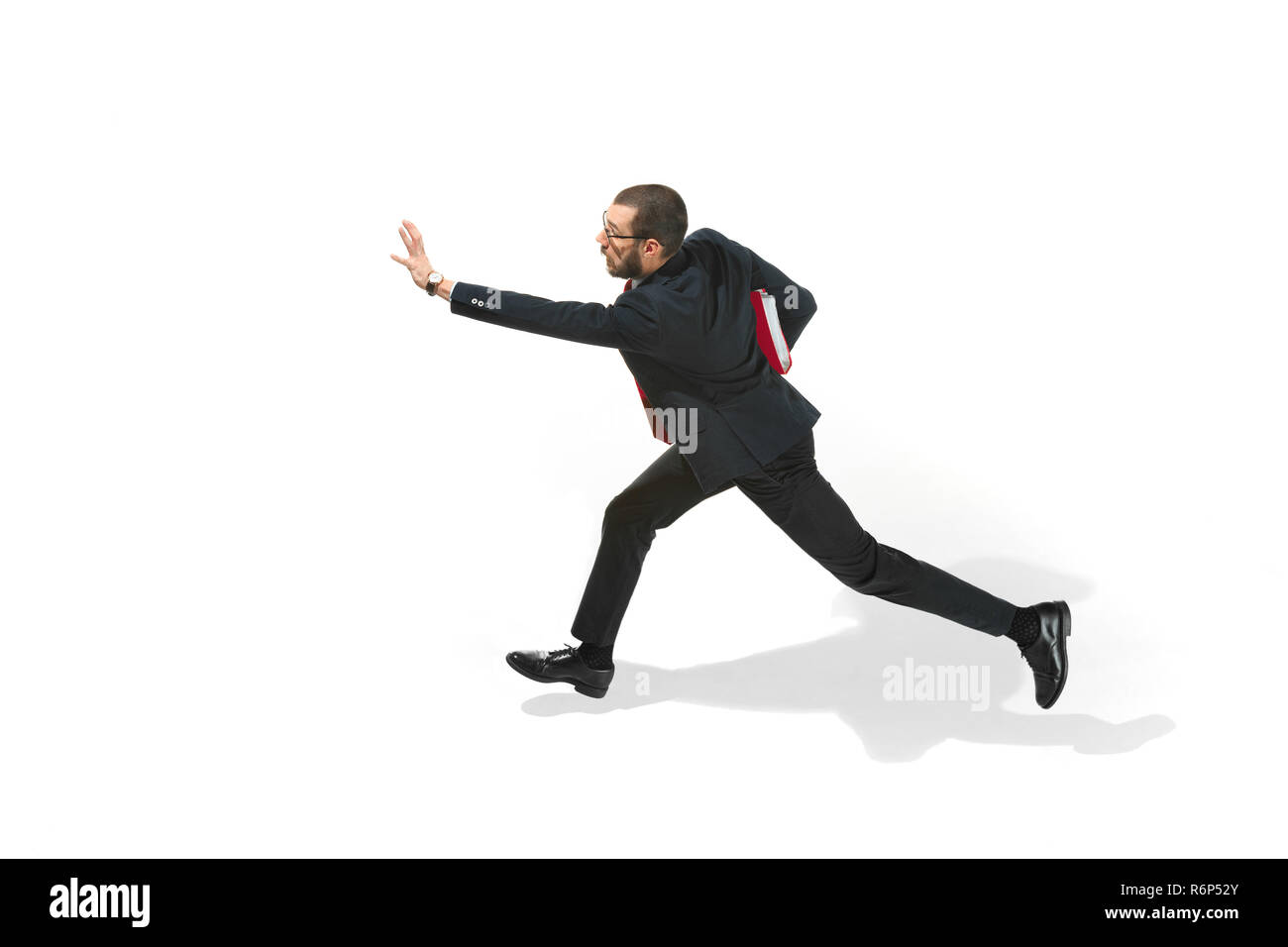 Businessman running with a folder on white background Stock Photo