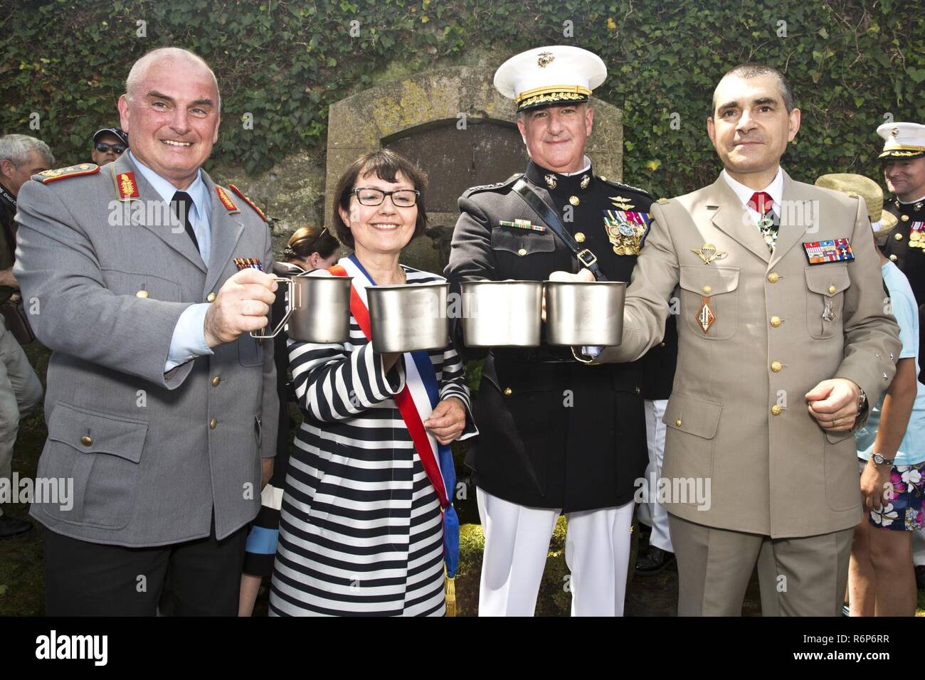 Distinguished guests attending a Memorial Day reception prepare to