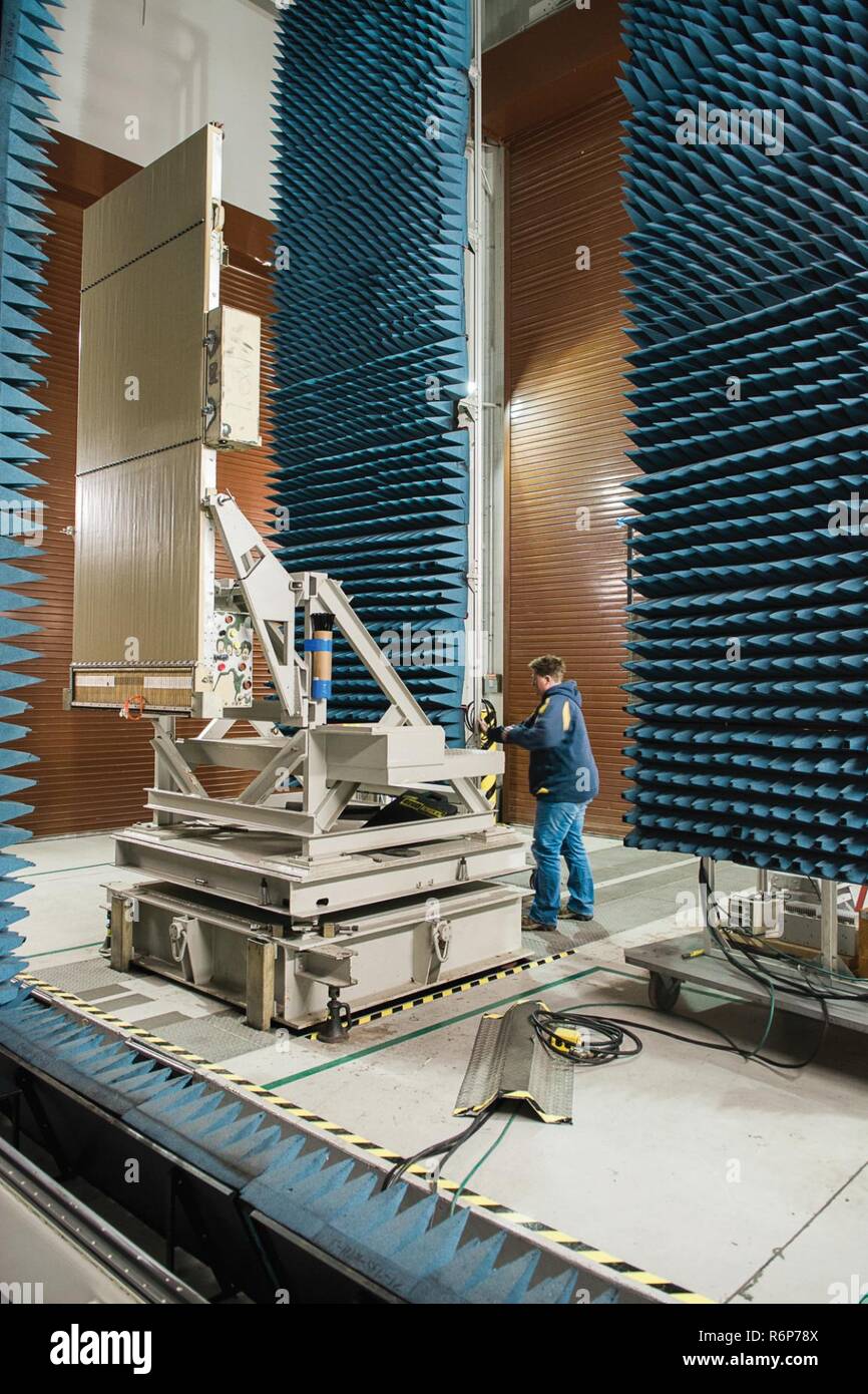 Electronics Mechanic Therese Paxton moves the radio frequency