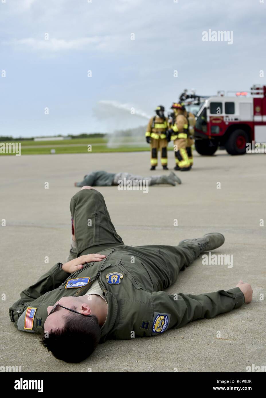 Capt. Matt McKay, a pilot trainee with the 757th Airlift Squadron here, portrays an accident victim during a Major Accident Response Exercise (MARE), May 16, 2017, while installation firefighters arrive and coordinate their initial response. The purpose of the exercise, conducted by the Wing Inspection Team and Emergency Management office, was to document response capabilities of installation personnel while honing joint response practices with local agencies including local law enforcement and the American Red Cross. Stock Photo