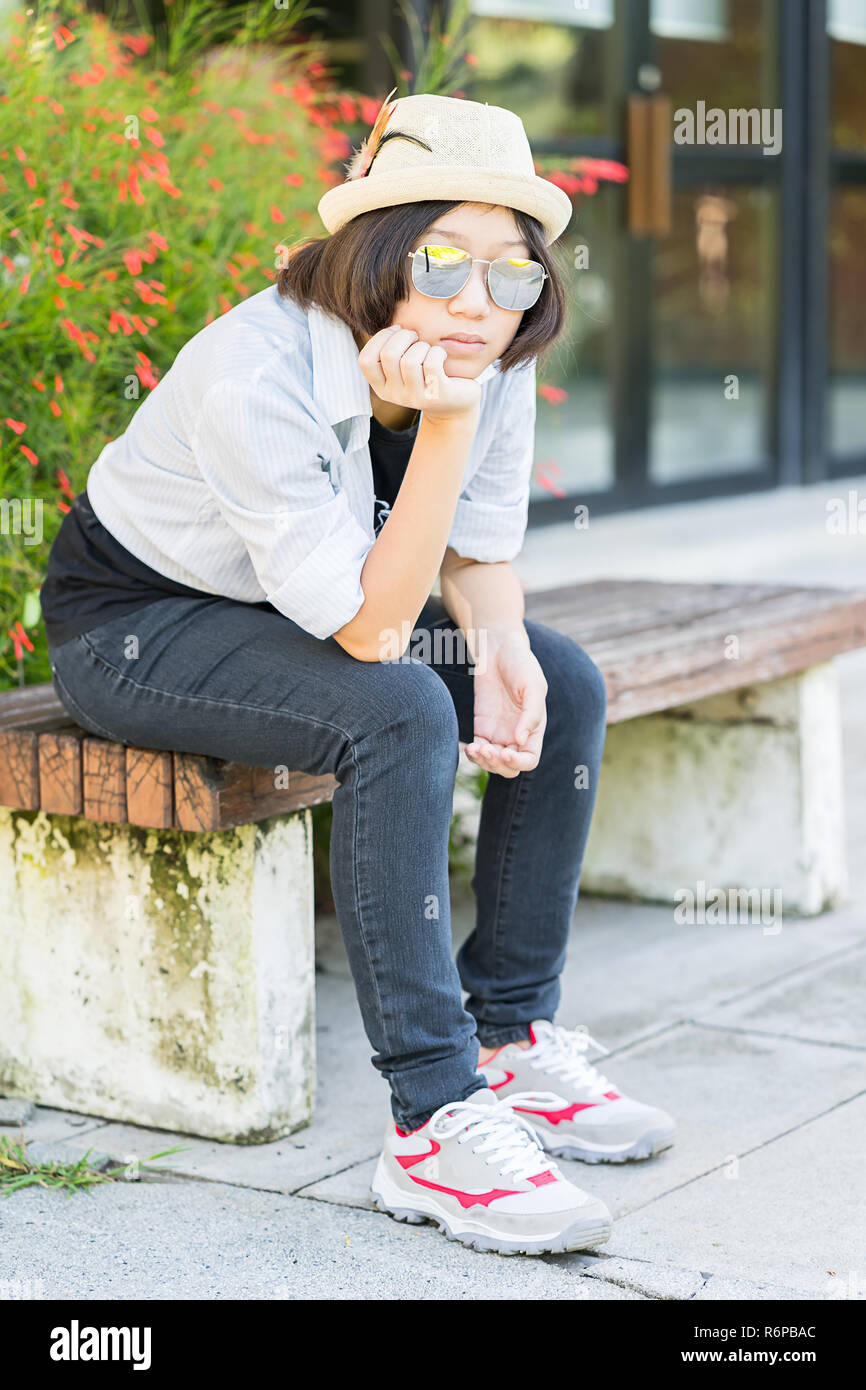 Women With Short Hair Wearing Hat In Park Stock Photo 227914580
