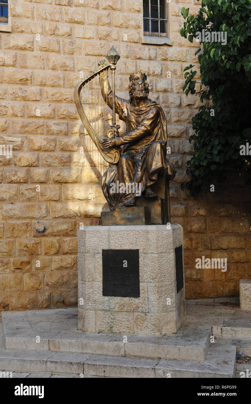 Statue of King David playing harp on traditional site of Mount Zion near the entrance to the tomb of David and room of last supper with disciples. Stock Photo