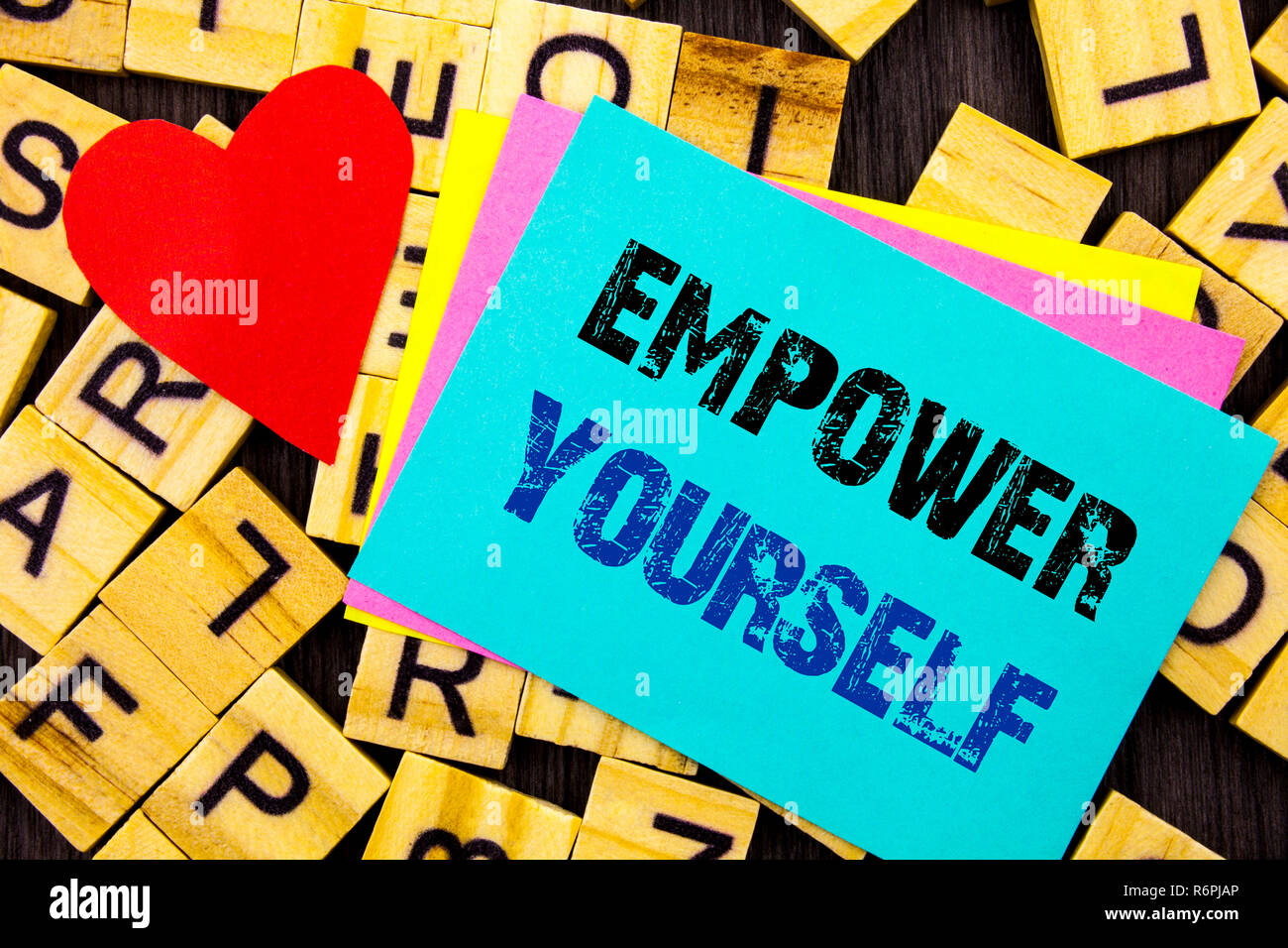 Handwritten text showing Empower Yourself. Conceptual photo Positive Motivation Advice For Personal Development written on colorful sticky note on the letter background Love Heart for Loving Stock Photo