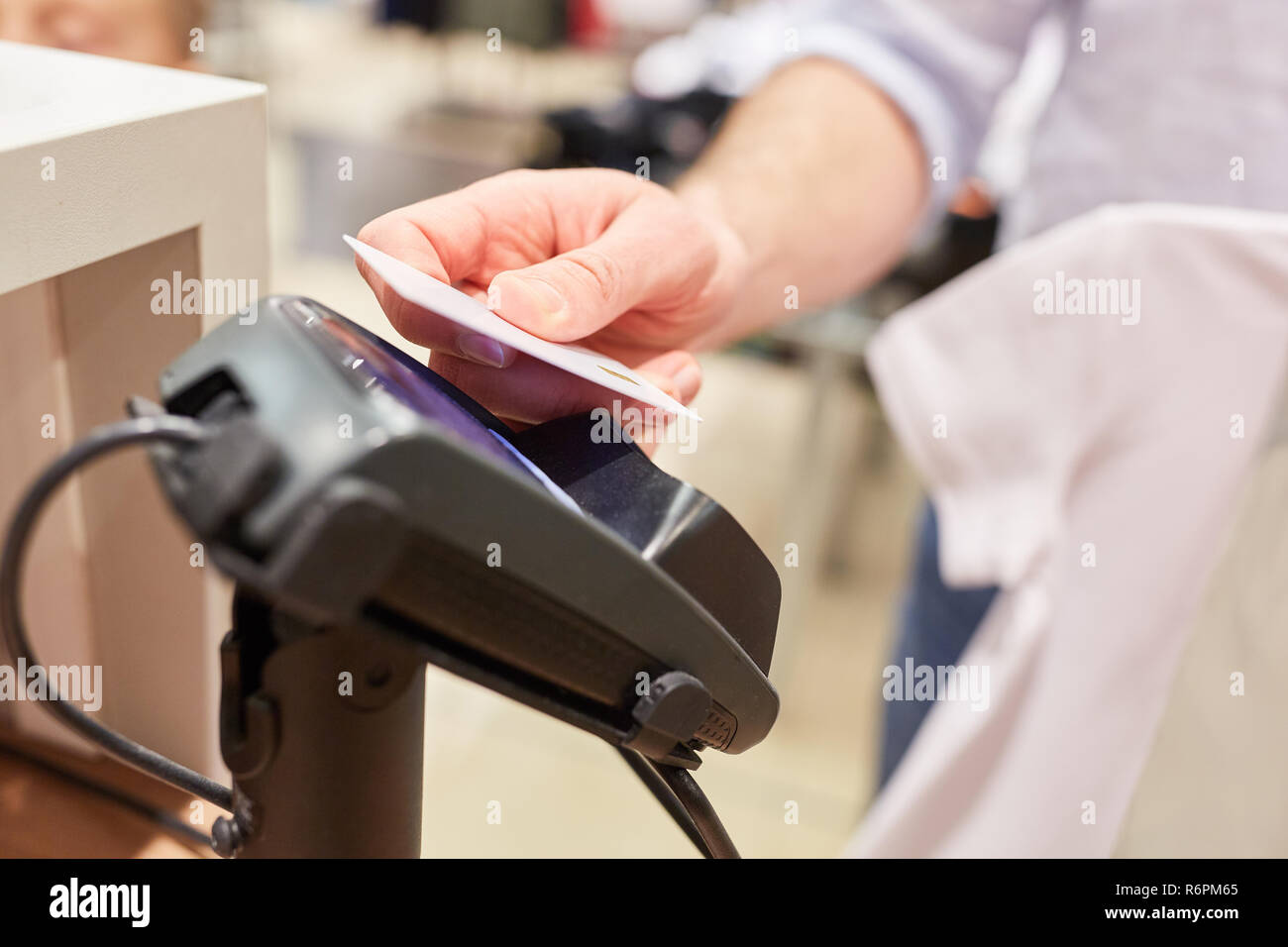 Customer contactless Payment with NFC credit card at the card terminal ...