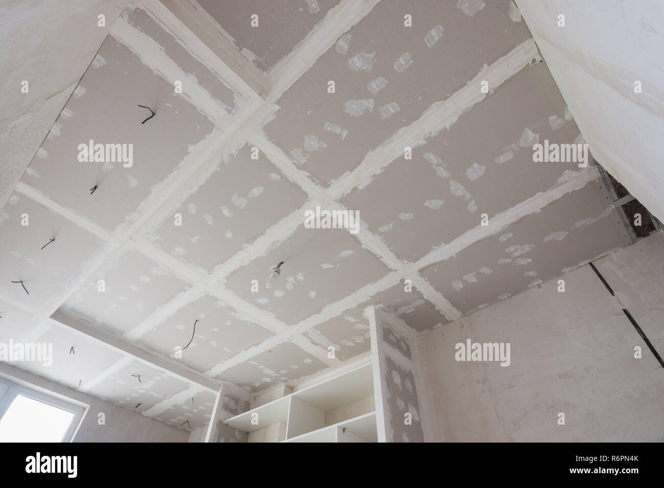 The Ceiling Is Covered With Plasterboard Sheets During The Repair