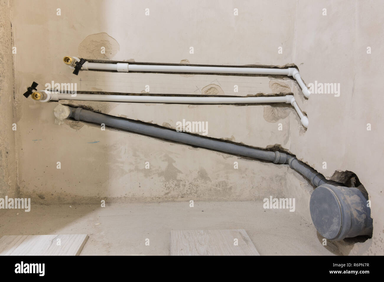 Water and sewage piping for toilet and washbasin installation Stock