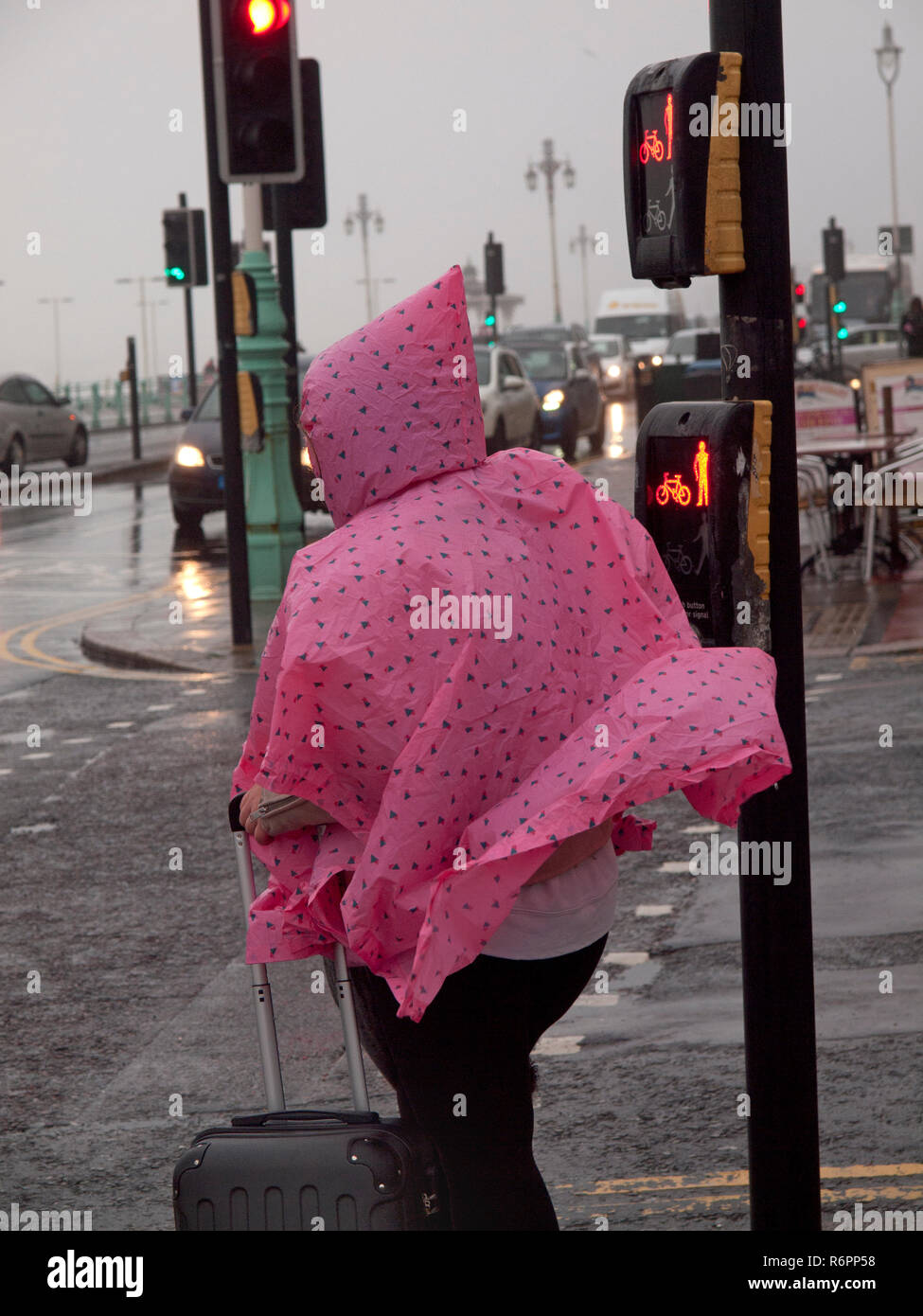 Woman in 'Love Pink' hoodie carries child wearing pink cagoule in Edinburgh  Scotland Stock Photo - Alamy
