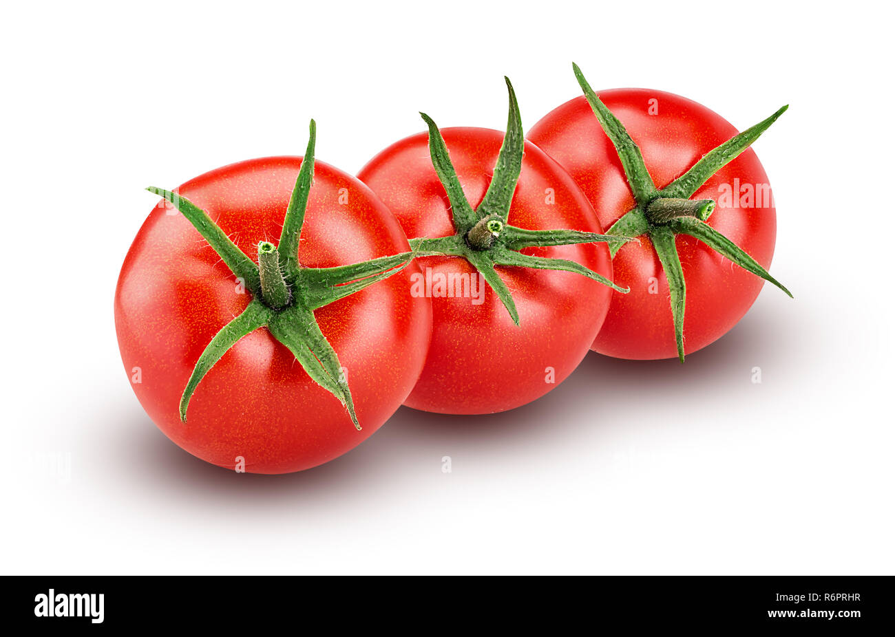 Three fresh red tomato with green leaves isolated on white background Clipping Path. Full depth of field. Stock Photo