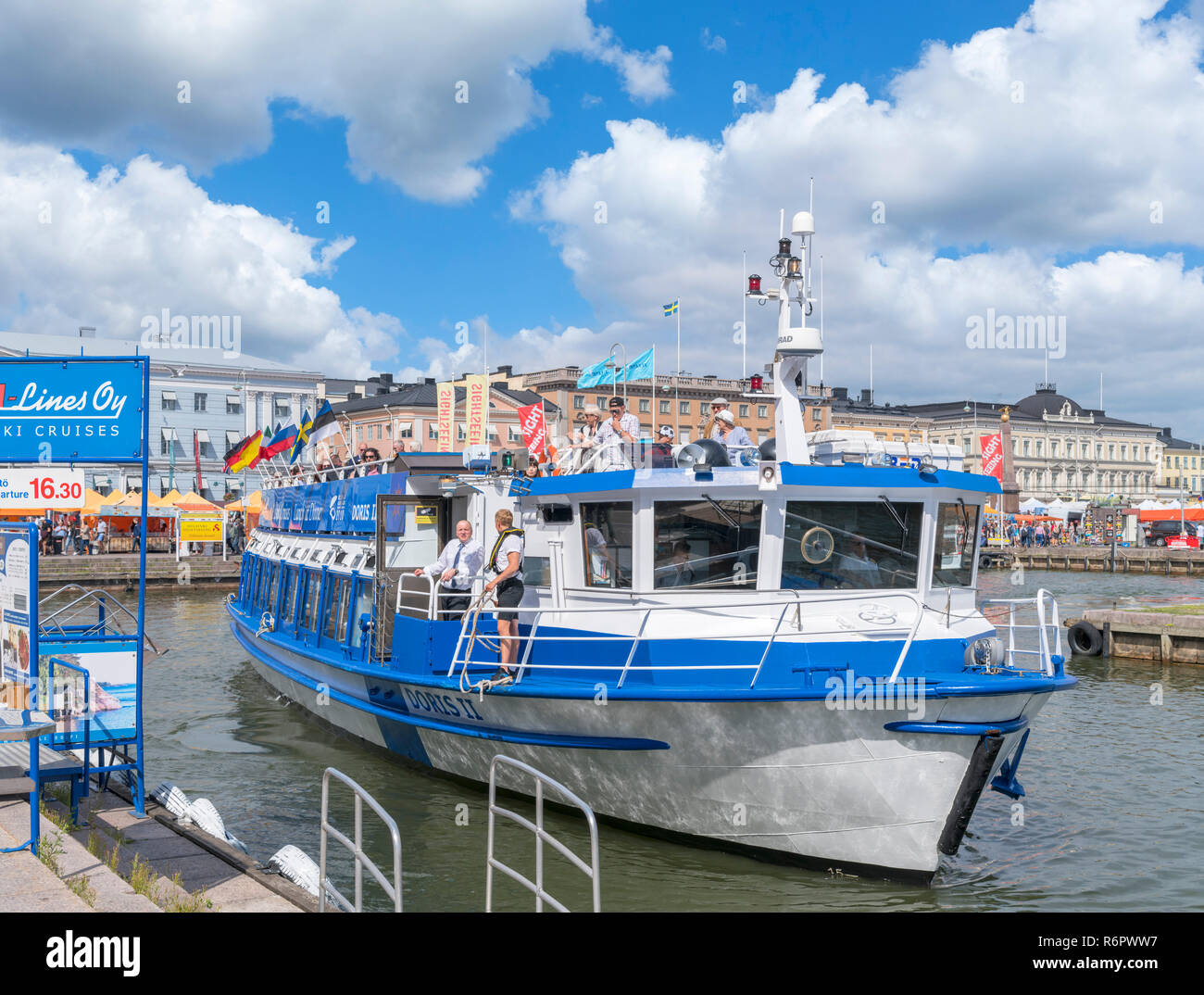 Sighseeing boat docking at the harbour at Kauppatori (Market Square), Helsinki, Finland Stock Photo