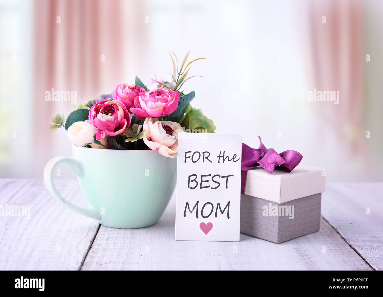 mother's day greeting card. flowers and gift box. Stock Photo