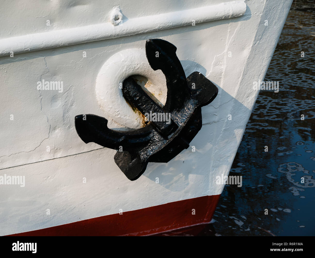Black anchor on a white ship. Stock Photo