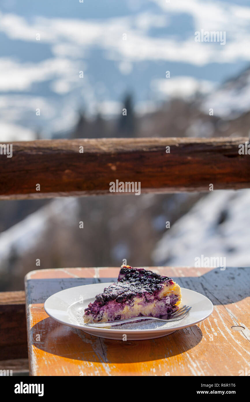outdoor blueberry cheesecake in the mountains Stock Photo