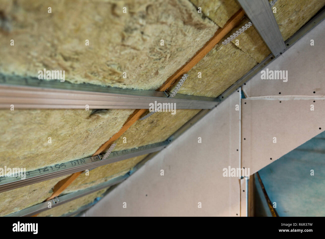 House Attic Under Construction Mansard Wall Insulation With