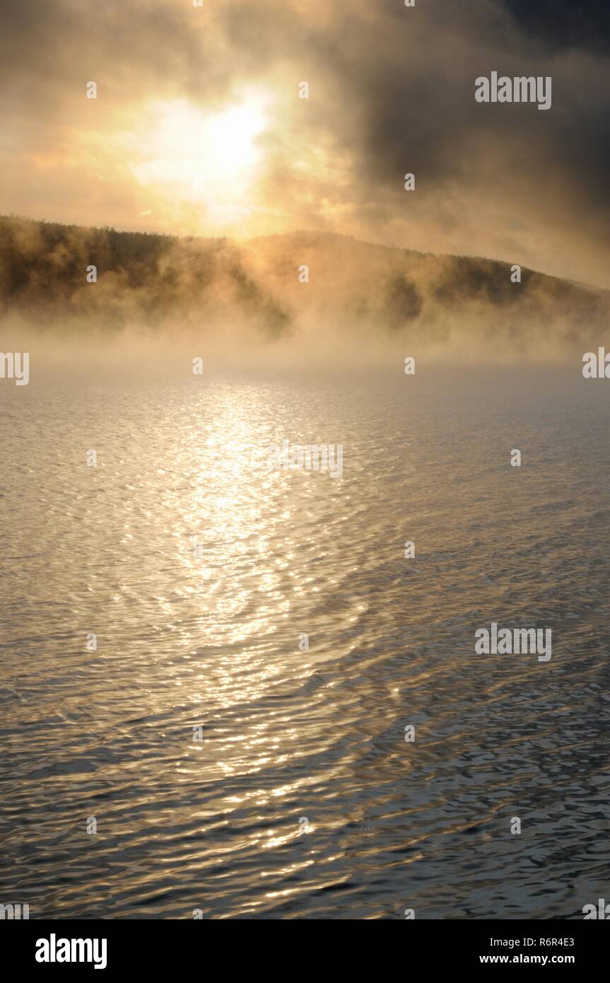 Winter cold foggy dawn on the Yenisei river near Krasnoyarsk in Siberia, Russia Stock Photo