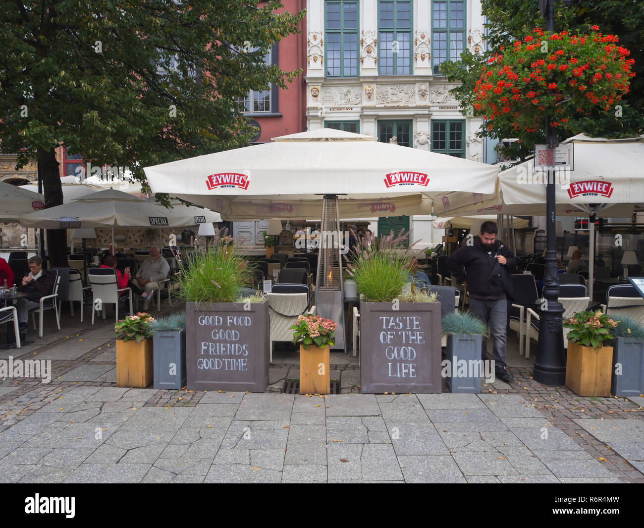 Open air restaurant in the historical and touristic center Długi Targ  in Gdansk Poland advertising the good life Stock Photo