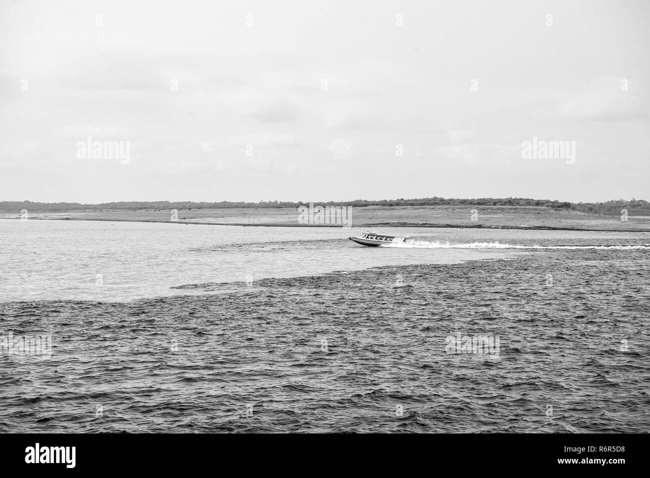 water meeting in brazil amazon river with rio del negro clean and dirty river water with