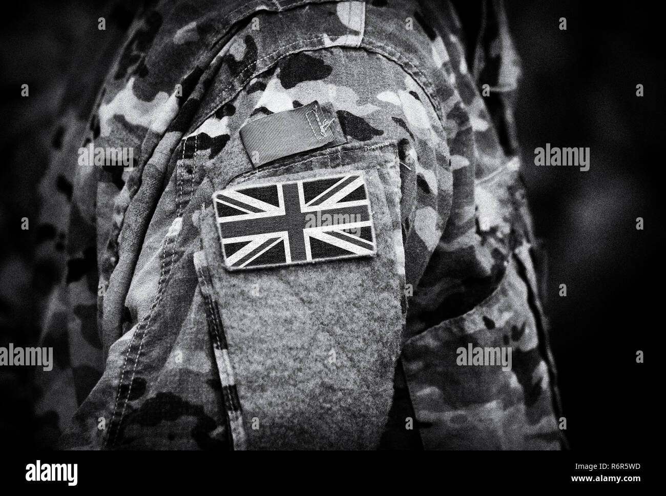 Flag of United Kingdom on soldiers arm. Flag of UK on military uniforms (collage). Stock Photo