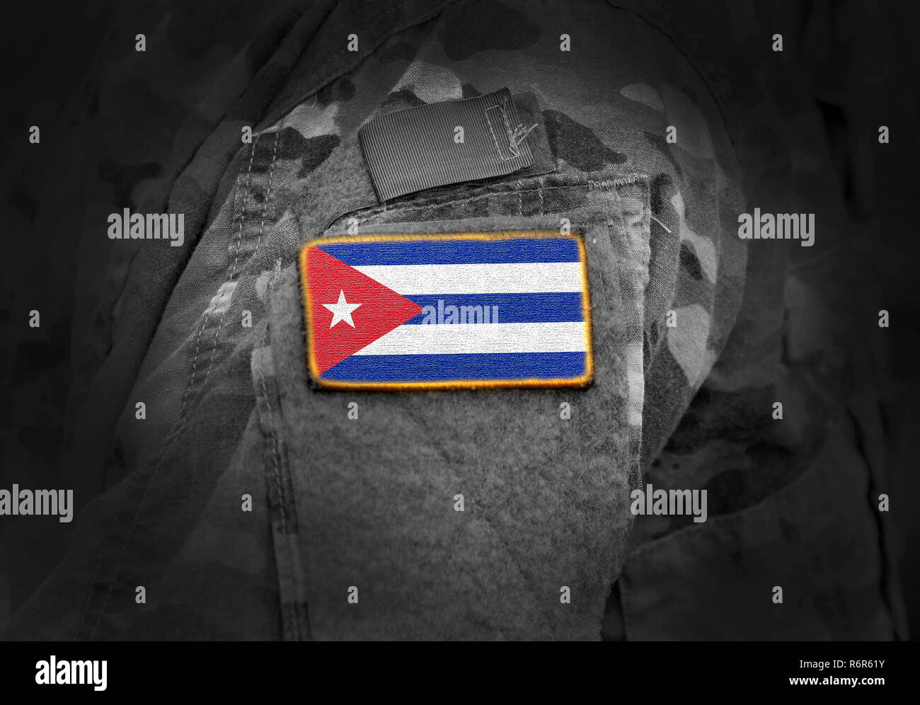 Flag of Cuba on soldiers arm. Flag of Cuba on military uniforms (collage). Stock Photo