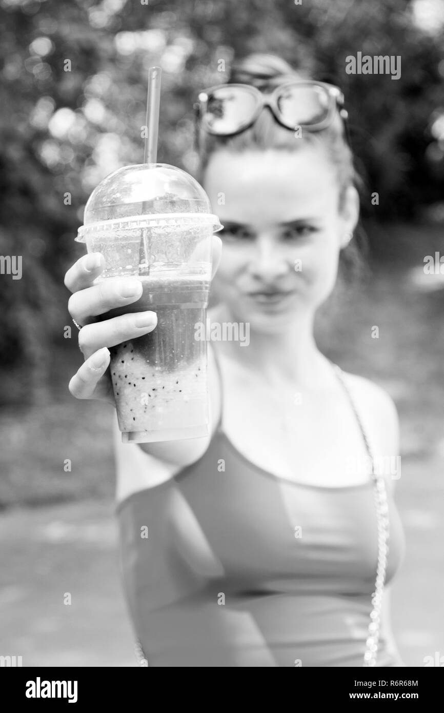 Young girl having a good morning healthy breakfast smoothie drink made