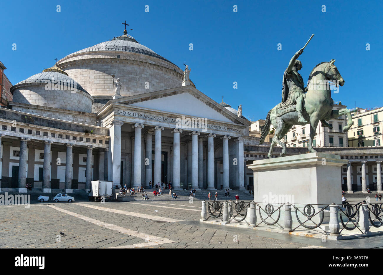 The Royal Basilica of San Francesco di Paola and an equestrian statue of Ferdinando I,  in the  Piazza del Plebiscito, Naples, Italy. Stock Photo