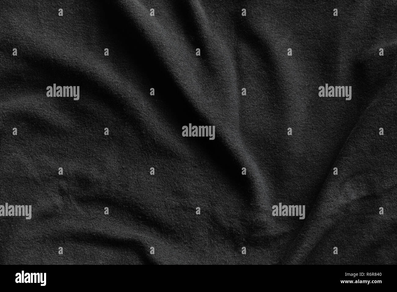 Black fleece, texture of soft napped insulating fabric made from