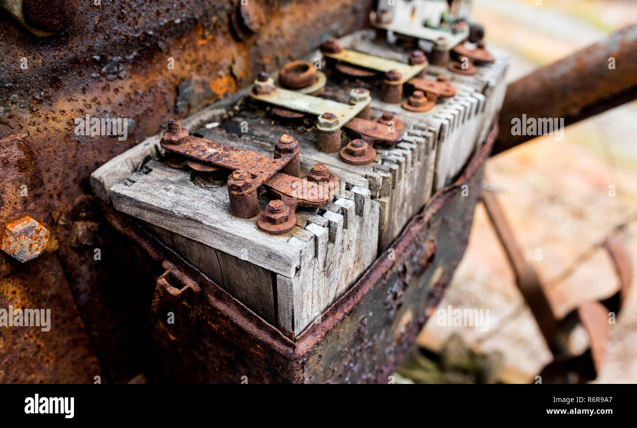 Vintage antique automotive wooden ignition coils covered in rust and