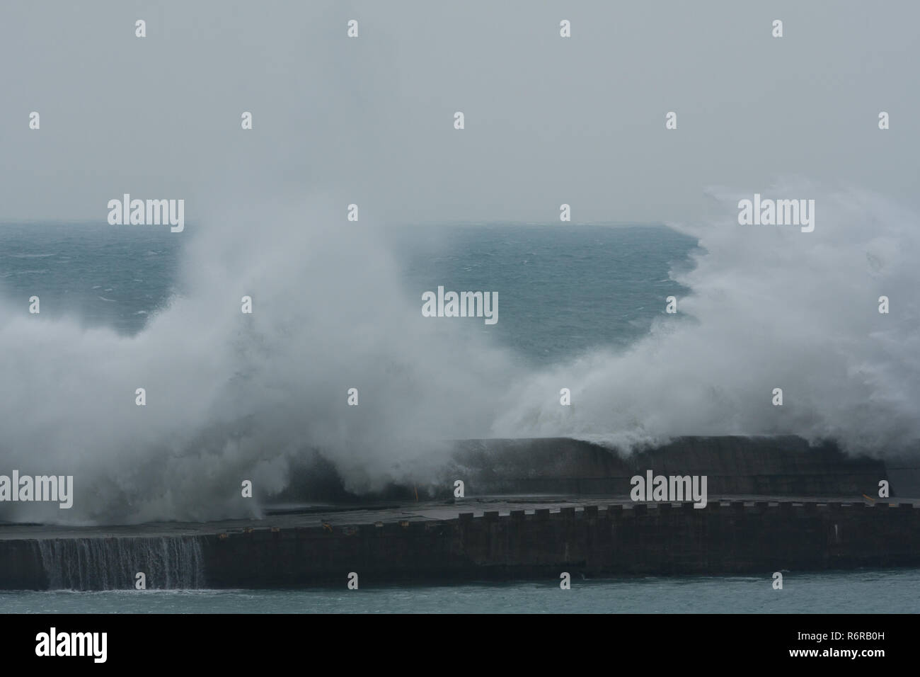 Typhoon Parma sends large waves crashing into the breakwater wall at a port in Hualien City as it stalls south of the island on Oct. 7th, 2009 Stock Photo