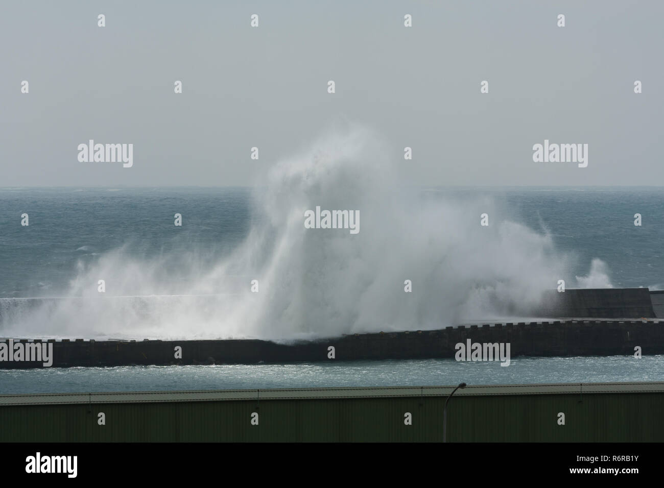 Typhoon Parma sends large waves crashing into the breakwater wall at a port in Hualien City as it stalls south of the island on Oct. 7th, 2009 Stock Photo