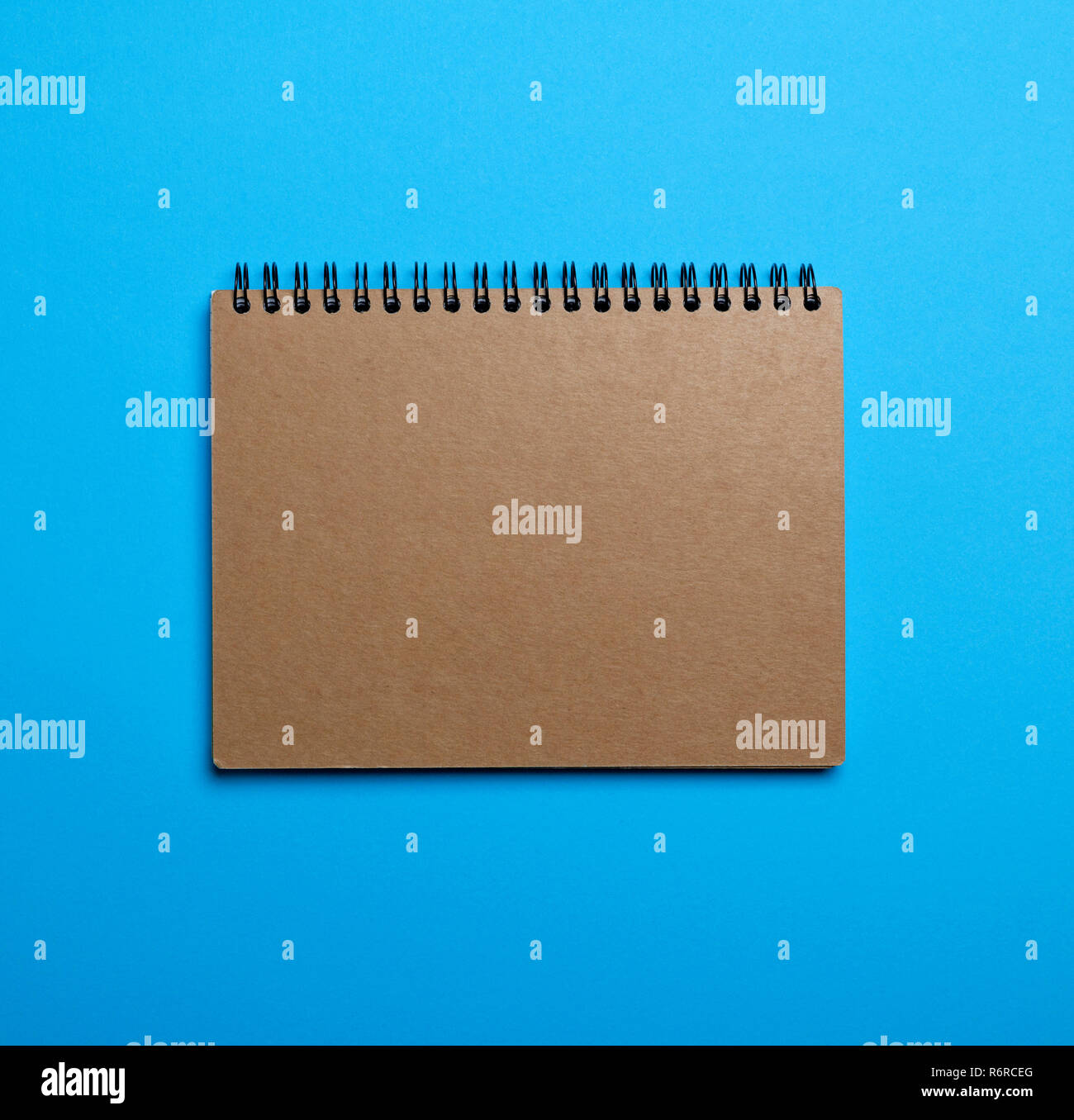 Spring Notebook Empty notebook on a black iron spring with brown empty sheets Stock Photo - Alamy