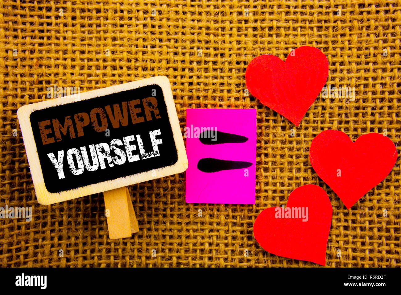 Writing text showing  Empower Yourself. Concept meaning Positive Motivation Advice For Personal Development written on blackboard equation Meaning Love Heart on the textured background Stock Photo