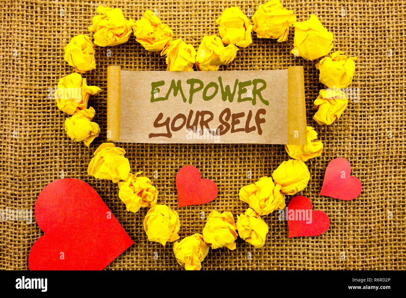 Handwriting Announcement text showing Empower Yourself. Concept meaning Positive Motivation Advice For Personal Development written on Sticky Note Paper With Heart on the textured background Stock Photo