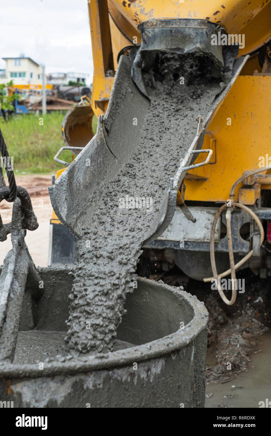 Pouring cement down from the cement mixer truck in construction site Stock  Photo - Alamy