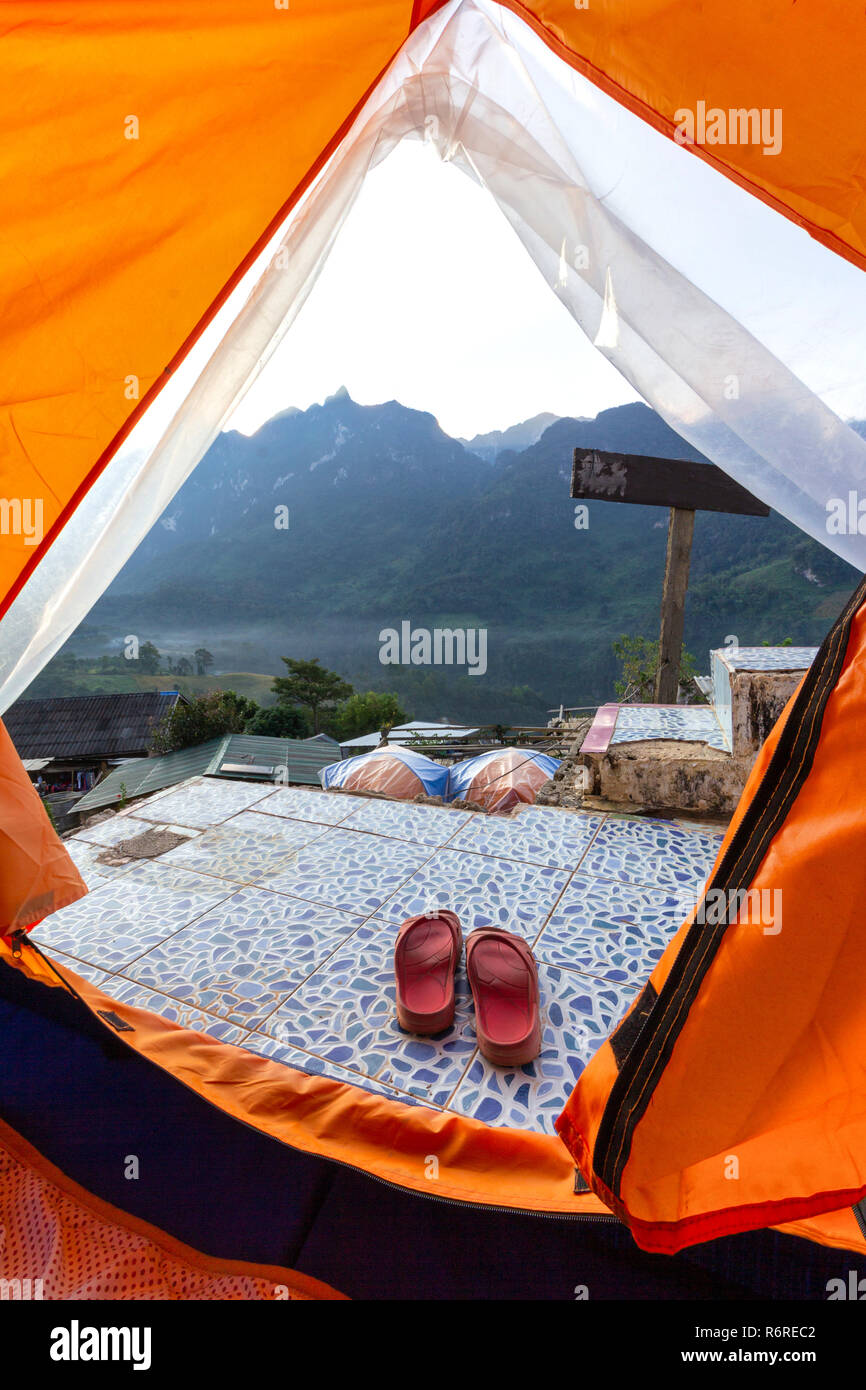 Slippers placing outside the tent in front of mountain view Stock Photo -  Alamy