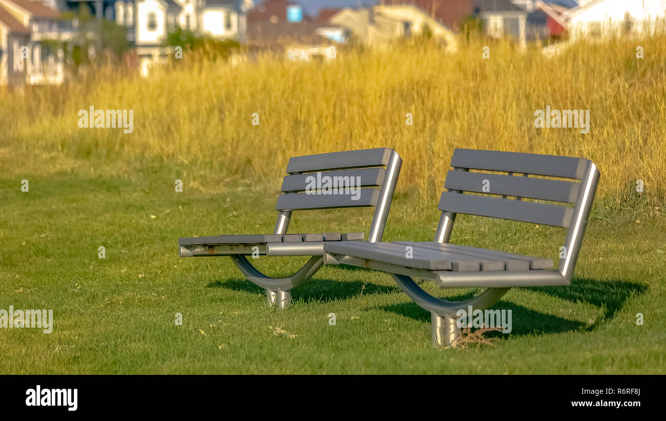 Metal Benches On A Sunny Park In Daybreak Utah Stock Photo