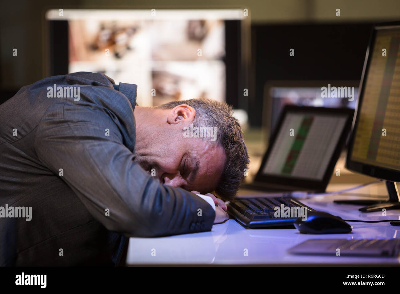 Tired Businessman Sleeping In Office Stock Photo - Alamy
