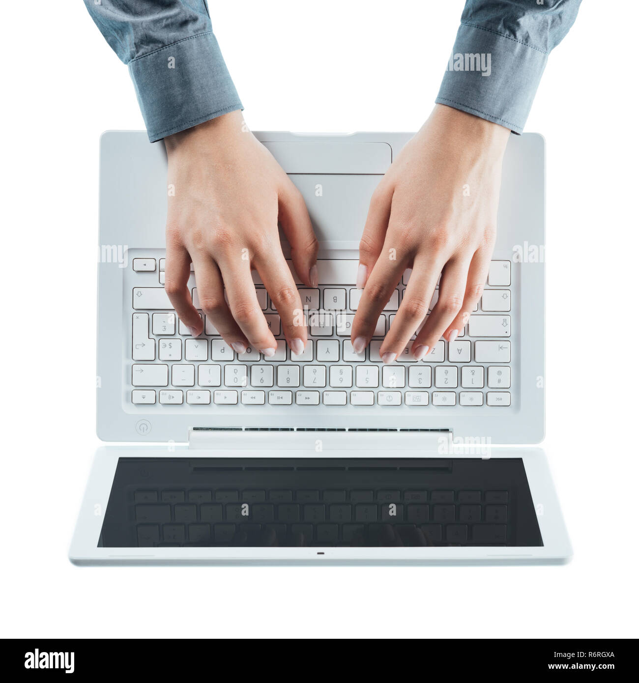 Blogger typing on a laptop Stock Photo - Alamy