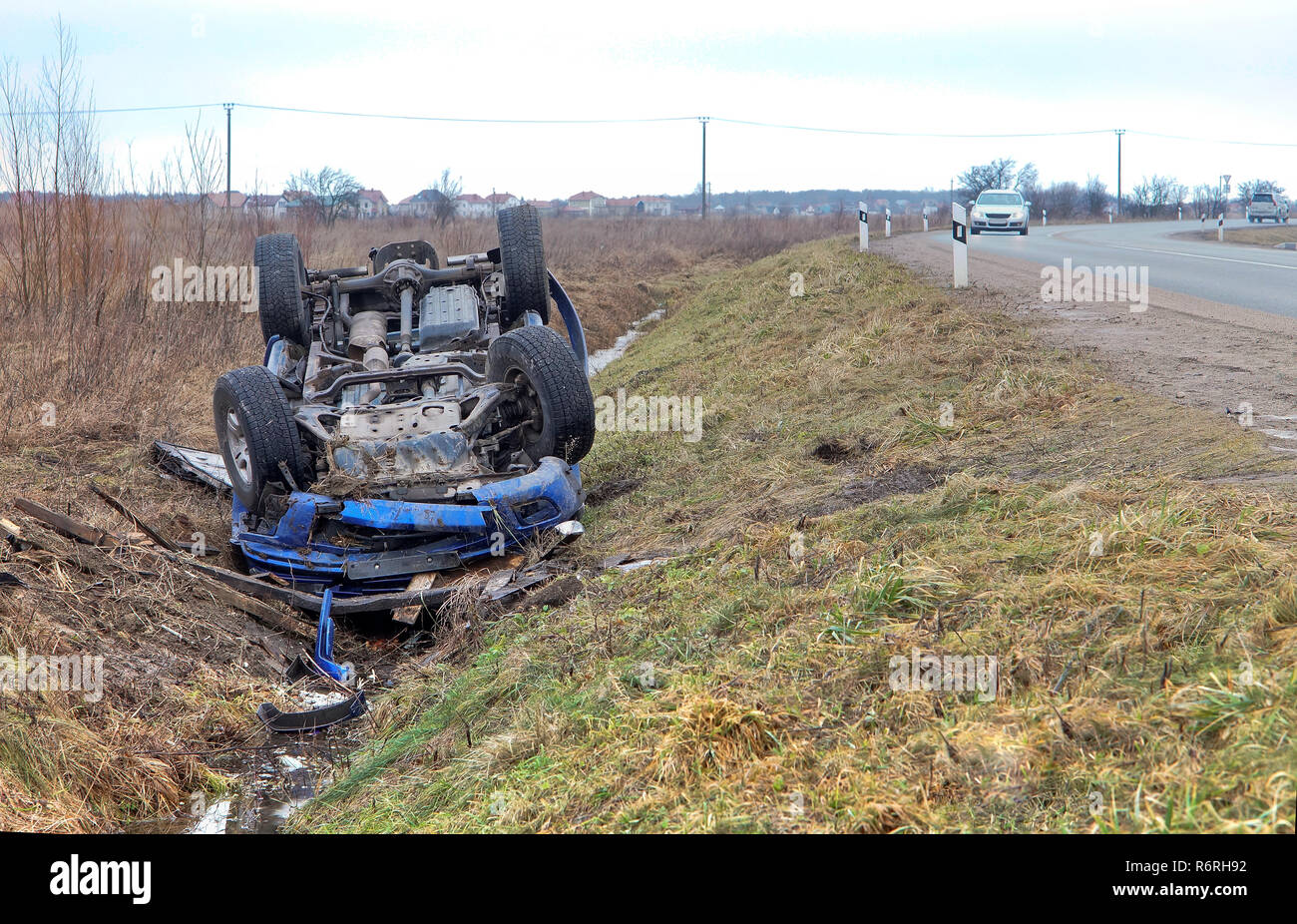 car crash, blue car overturned on the road transport traffic accident Stock Photo