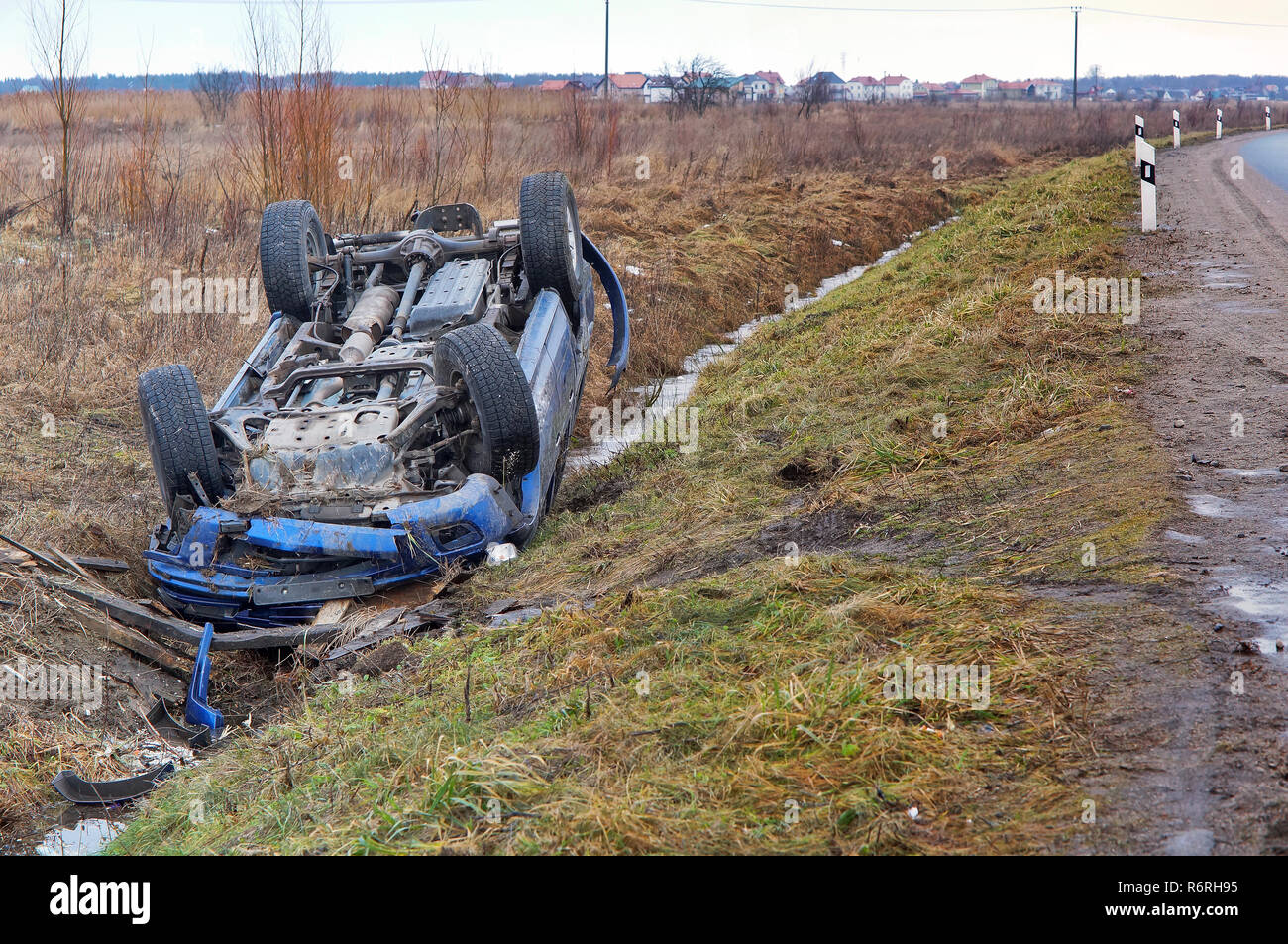 car crash, blue car overturned on the road transport traffic accident Stock Photo