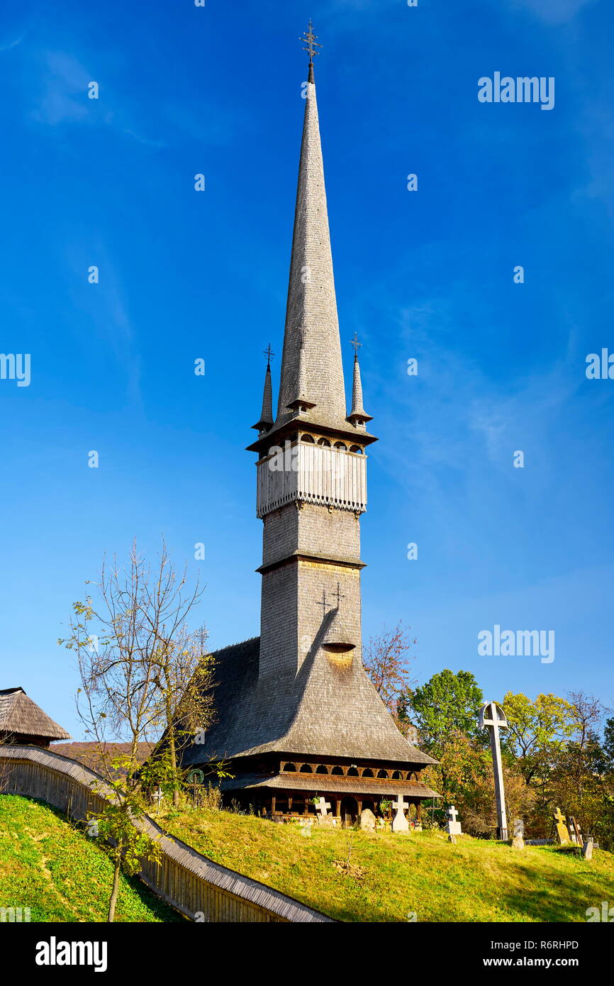 Wooden 18th c. Catholic Church, village of Surdesti, Maramures,  Romania, UNESCO Stock Photo