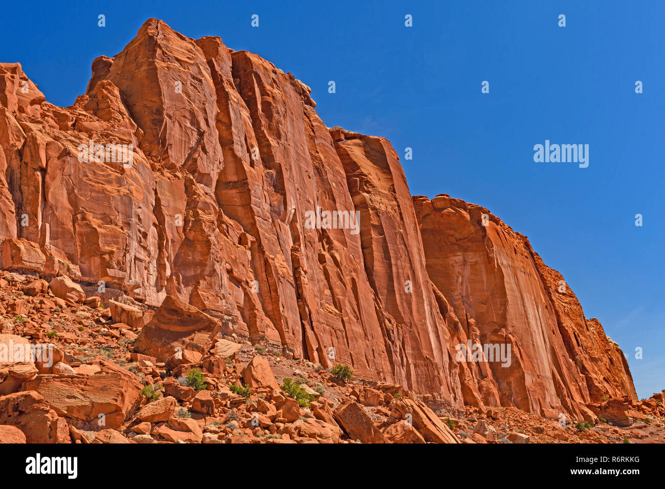 Dramatic Cliffs Soaring into a Blue Desert Sky Stock Photo