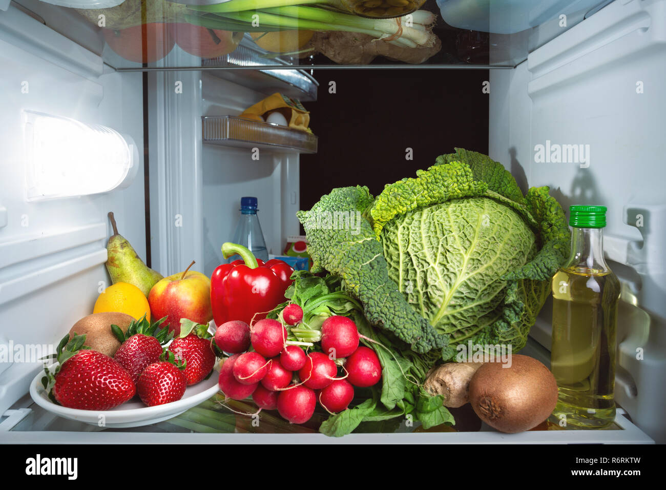 Fridge full of fruits and vegetables Stock Photo