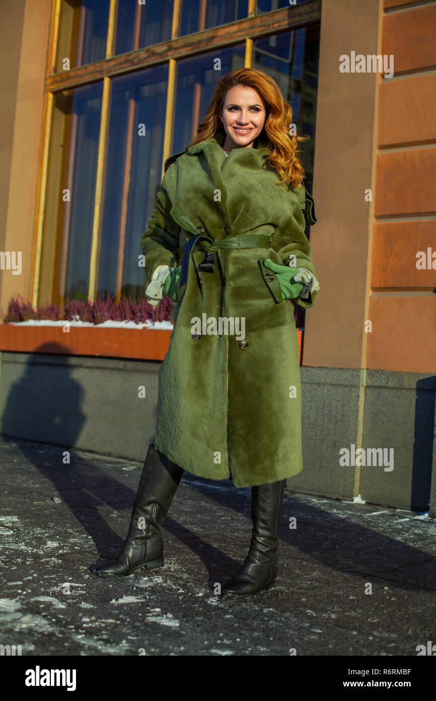 Perfect winter woman wearing green coat, fashion portrait Stock Photo