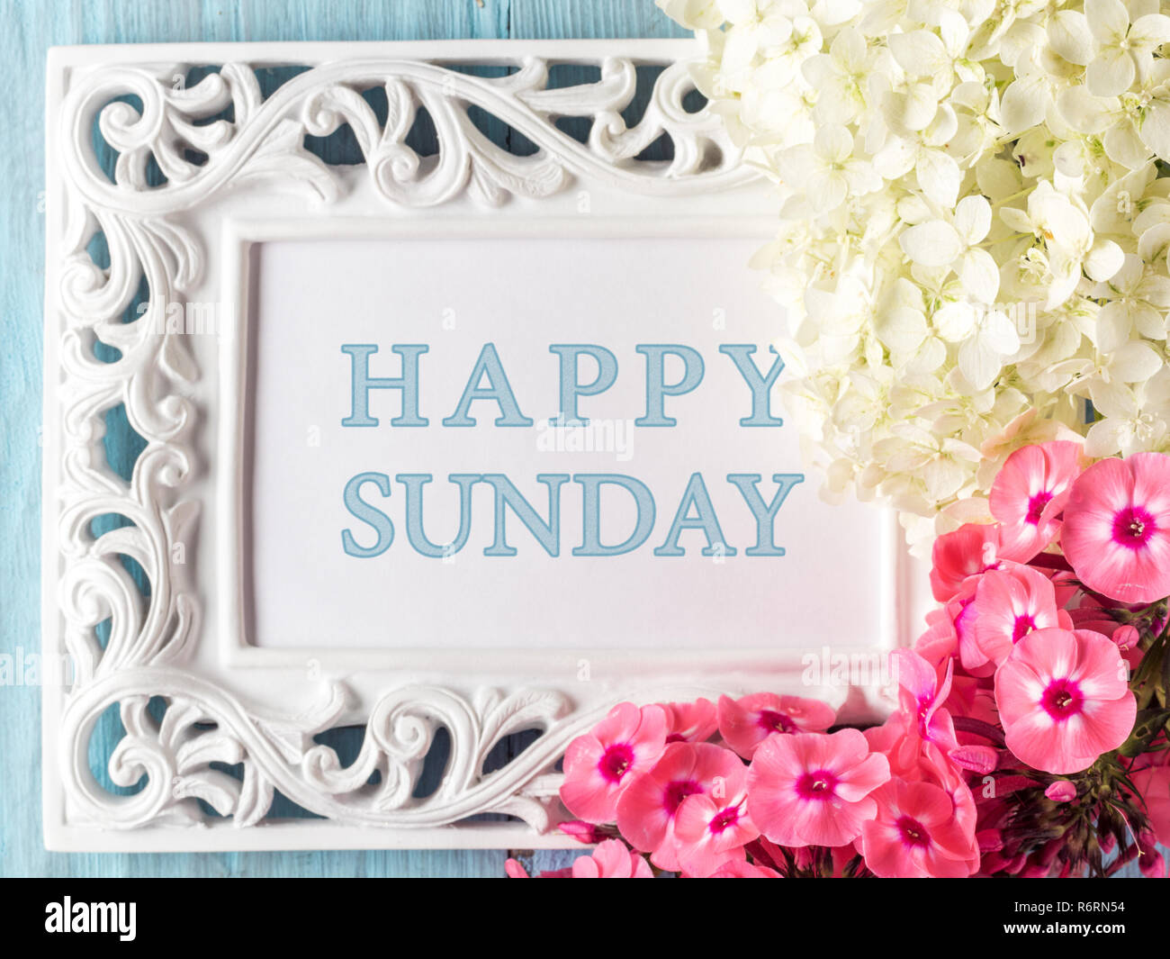 Frame with flowers and text: Happy sunday Stock Photo - Alamy