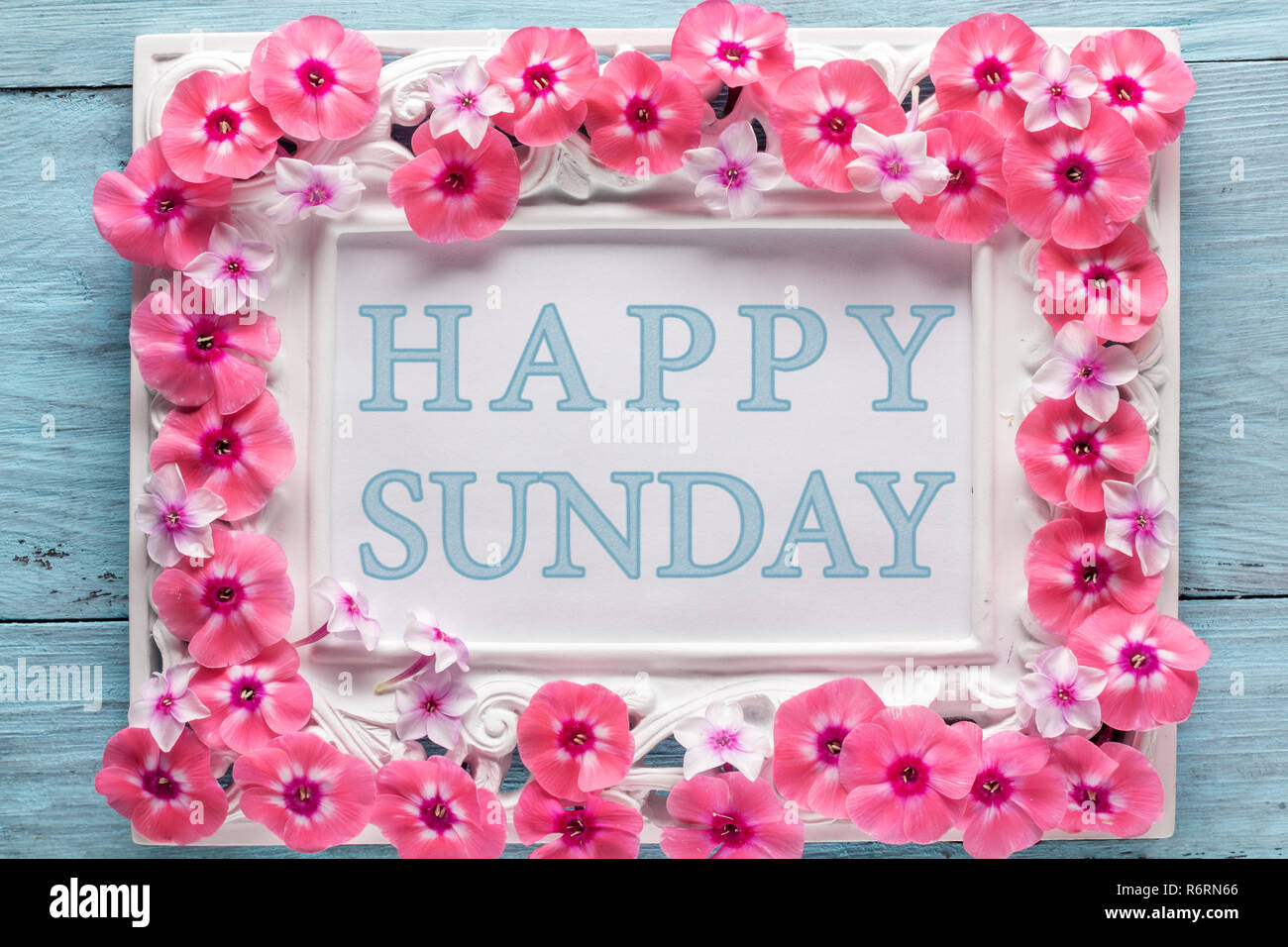 Frame with flowers and text: Happy sunday Stock Photo - Alamy