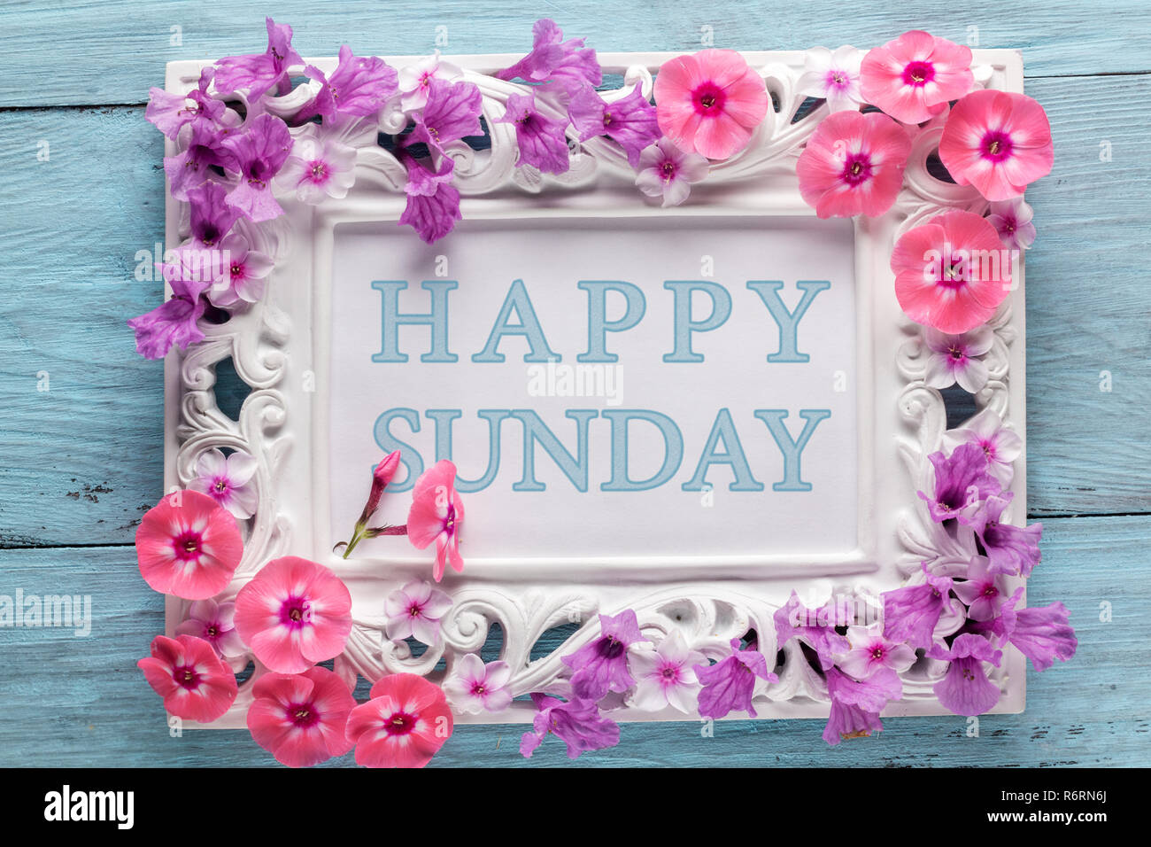 Frame with flowers and text: Happy sunday Stock Photo - Alamy