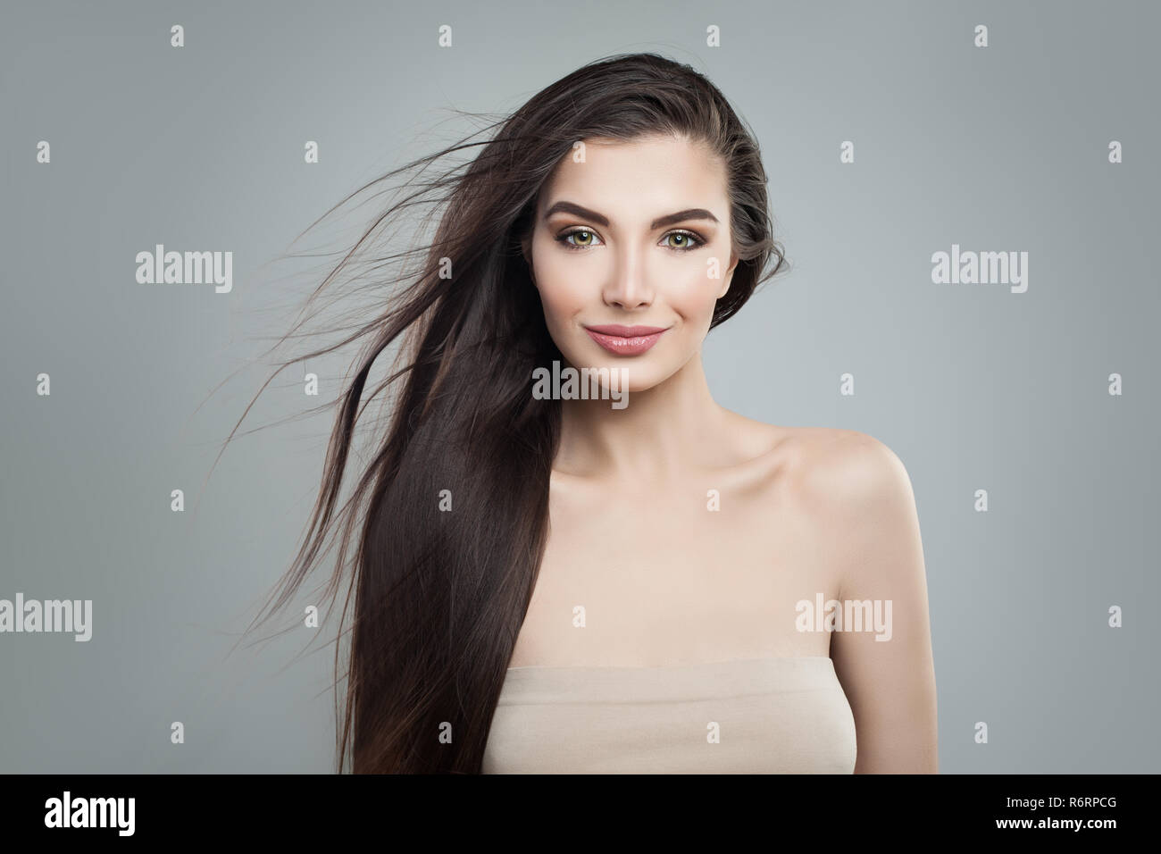 Young Woman Fashion Model With Long Dark Hairstyle Makeup