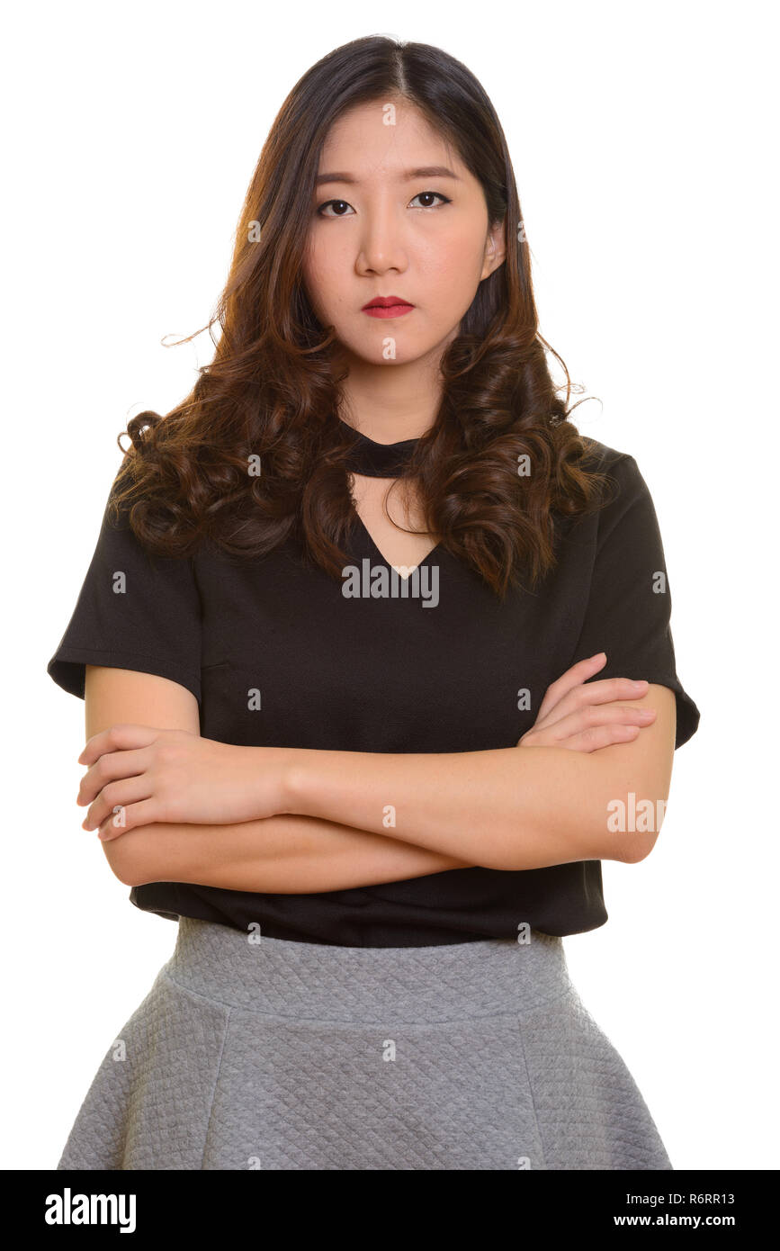 Portrait of young beautiful Asian businesswoman with arms crossed Stock ...