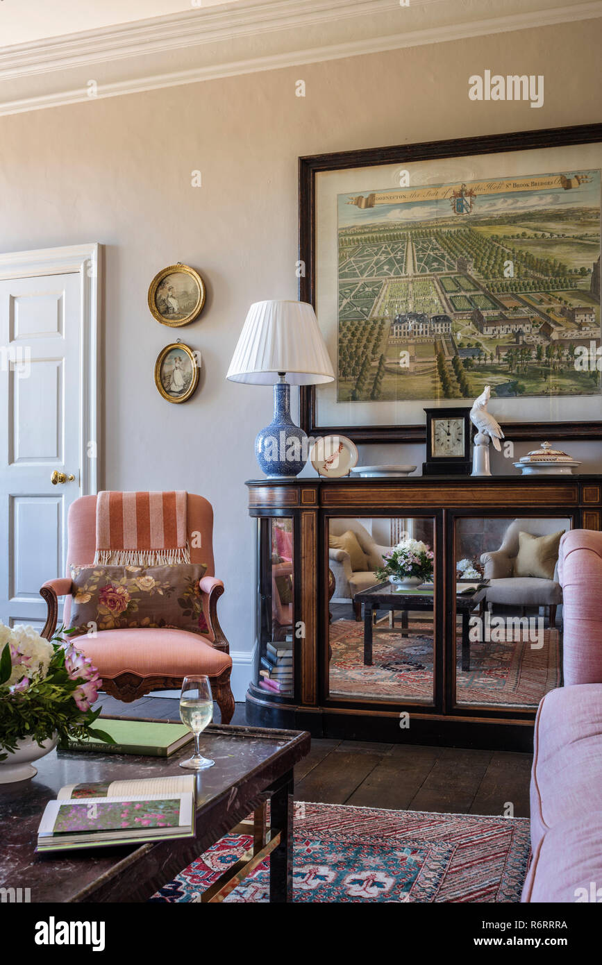 Framed artwork above mirrored sideboard in 18th century Goodnestone